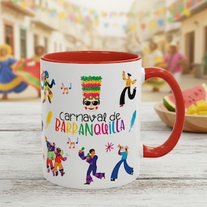 May include: White ceramic mug with a red interior and handle, featuring colorful illustrations of dancers, musical notes, and the text "Carnaval de Barranquilla." The mug is decorated with a festive design.