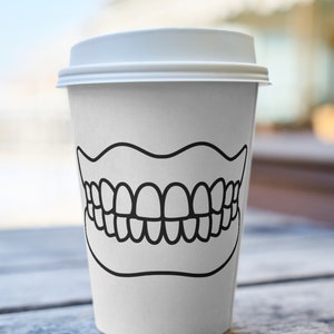 May include: White to-go coffee cup with a black outline of a set of teeth on the front.