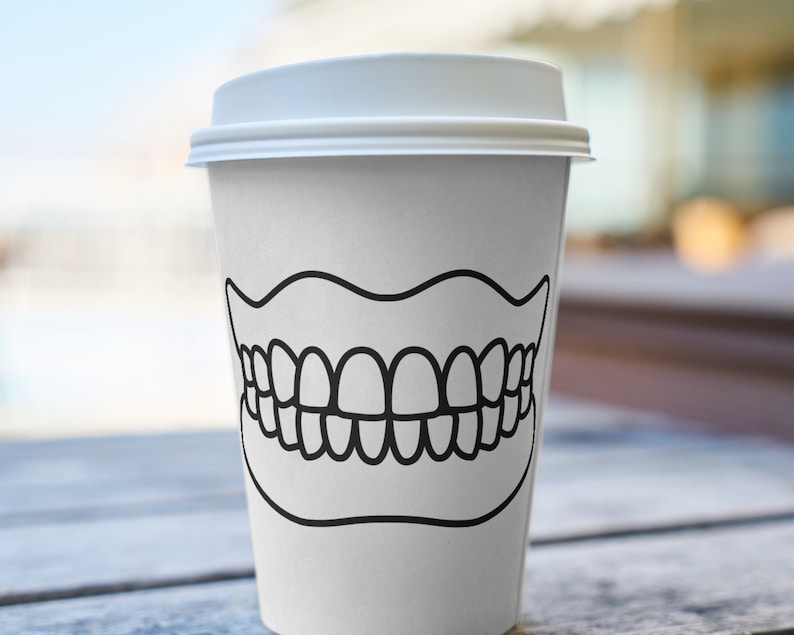 May include: White to-go coffee cup with a black outline of a set of teeth on the front.