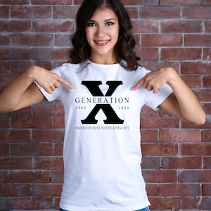 May include: White t-shirt with a black graphic that says "Generation X 1965-1980 Raised on hose water & neglect"