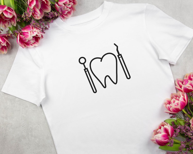 May include: White t-shirt with a black outline of a tooth and dental tools.