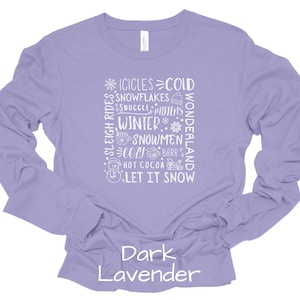 May include: A long-sleeved shirt in a dark lavender color with a white graphic design that says "Sleigh Rides, Icicles, Cold, Snowflakes, Snuggle Mittens, Winter, Snowmen, Cozy, Brrr, Hot Cocoa, Wonderland, Let It Snow".