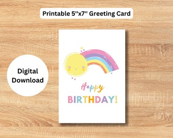 May include: Printable 5"x7" greeting card featuring a yellow sun with a rainbow over it. The text "Happy Birthday!" is written in colorful letters.