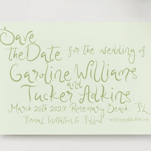 May include: A rectangular light green card featuring dark green handwritten calligraphy that reads: Save the Date for the wedding of Caroline Williams and Tucker Adkins, March 20th 2027 Rosemary Beach, FL. Formal Invitation to Follows carolineandtucker.com.