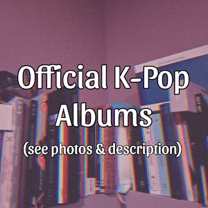 May include: Image showing a collection of K-Pop albums, with the text "Official K-Pop Albums" in a white, bold font. The albums are stacked on a shelf, with the text "(see photos & description)" below the title. The background is a muted purple.