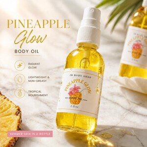 May include: A clear glass bottle of Pineapple Glow Body Oil with a white label featuring a pineapple illustration. The bottle contains a yellow liquid and is 2 fl oz. The text "Summer Skin in a Bottle" is also visible.