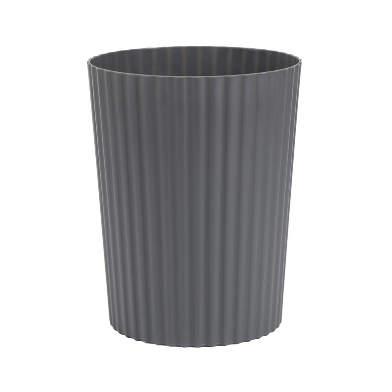 May include: A grey plastic waste bin with a ribbed texture. The bin is cylindrical and has a wide opening.