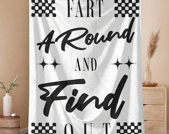 May include: White blanket with the text "FART AROUND AND FIND OUT" in black. The blanket has black checkered patterns at the top and bottom, with starburst designs between the words.
