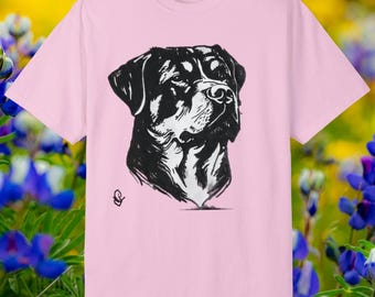 May include: A pink t-shirt with a black and white illustration of a Rottweiler dog's head.