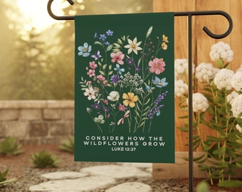 May include: A green garden flag with a floral design and the text "Consider how the wildflowers grow Luke 12:27".
