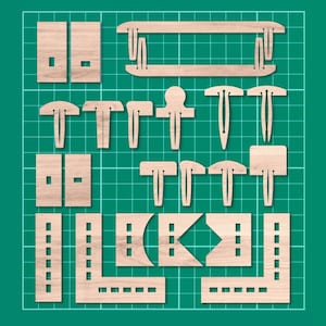 May include: A set of laser-cut wooden shapes for crafting. The shapes include rectangles, squares, and various geometric designs. The wood is a light brown colour.
