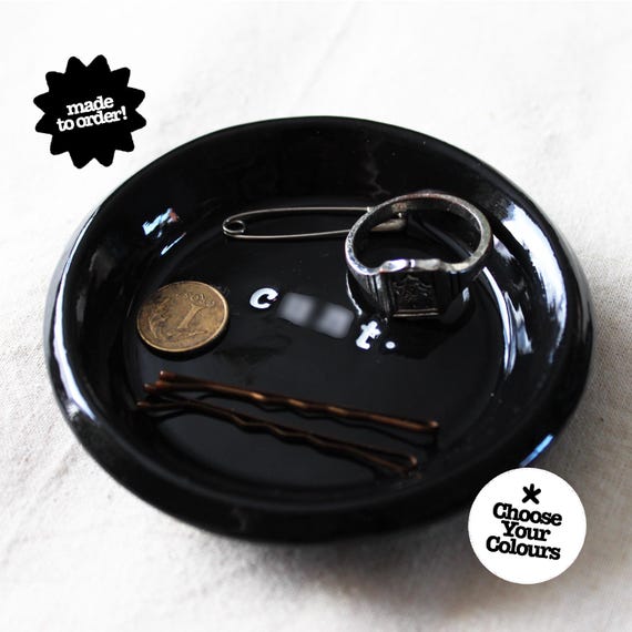 A handmade clay ring dish that doubles as a hilariously passive-aggressive piece of desk or vanity decor — the kind of thing that makes guests do a double-take.
