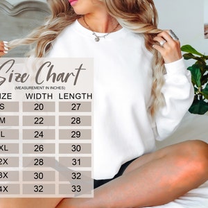 May include: Size chart for a white sweatshirt with measurements in inches. The chart shows the width and length of the sweatshirt in sizes S, M, L, XL, 2X, 3X, and 4X.