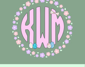 May include: Pink monogram with the letters KWM in a circle surrounded by a wreath of pastel pink and purple flowers. Three pastel Easter eggs are at the bottom of the circle.