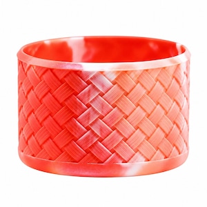 May include: A wide, cylindrical bangle bracelet featuring a vibrant coral-red color with a marbled effect. The exterior surface is embossed with a detailed, repeating diagonal basket-weave pattern that creates a textured, woven appearance.