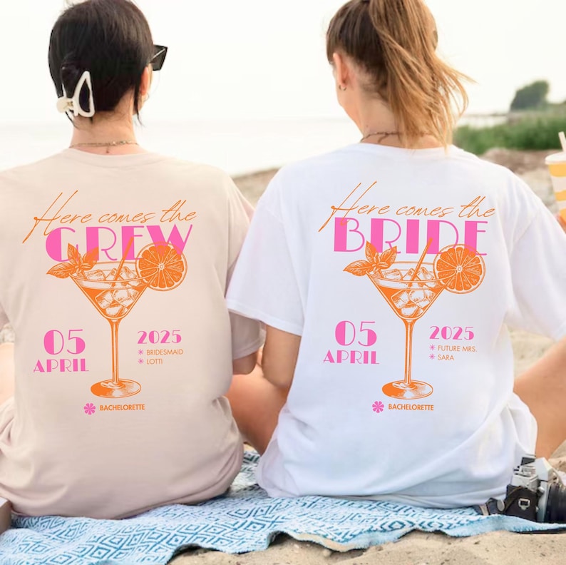 May include: Two t-shirts with a cocktail graphic. One is beige with "Here comes the CREW" and the other is white with "Here comes the BRIDE". Both have the date "05 APRIL 2025" and "BACHELORETTE" text.