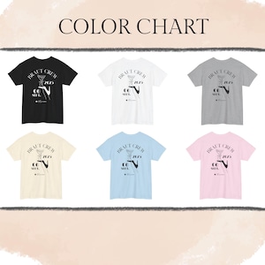 May include: Color chart featuring six t-shirts in various colors: black, white, gray, cream, light blue, and pink. Each shirt displays the text "BRAUT CREW 2023" with a cocktail glass graphic. The shirts are short-sleeved.