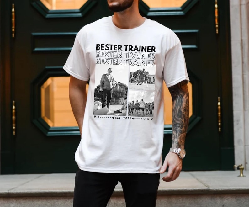 May include: White t-shirt with the text "BESTER TRAINER" repeated. The shirt has a black and white collage of images, including a person with a ball and a group of people. The text "EST. 2023" is also present.