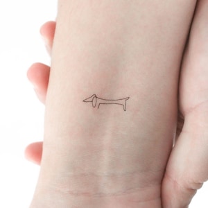 Tatuaggio temporaneo di un bassotto con una linea (set di 3)