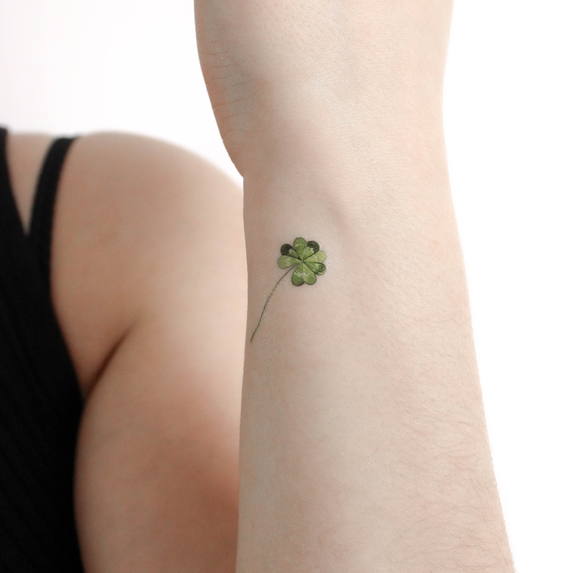 Small Black Four Leaf Clover Tattoo Idea