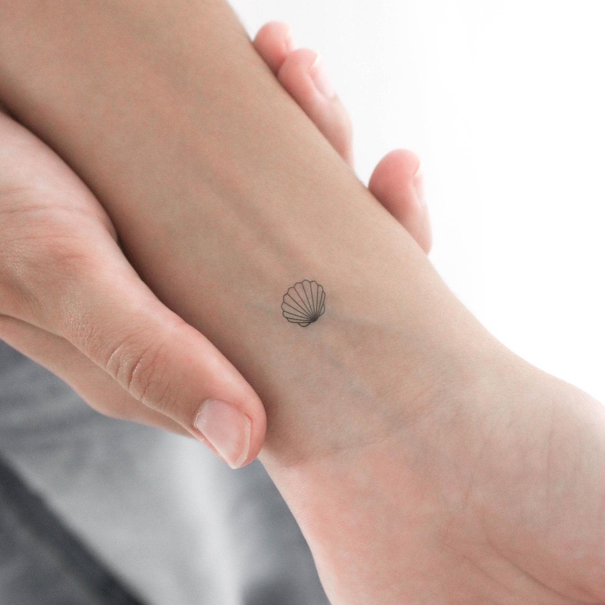 Fine Line Conch Shell Tattoo Design