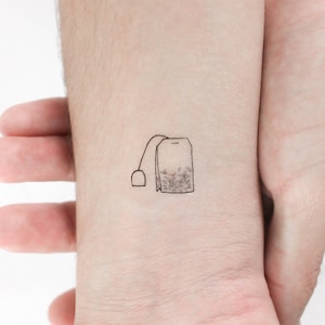 May include: A simple line drawing of a tea bag with a string and tag. The tea bag is filled with loose tea leaves.