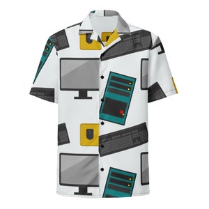 May include: A white short-sleeved button-down shirt with a repeating pattern of computer monitors, keyboards, and computer towers in shades of gray, black, yellow, teal, and red.
