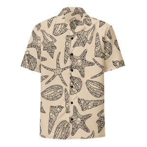 May include: A beige short-sleeved button-down shirt with a black and white pattern of seashells and starfish.