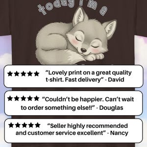 May include: A brown t-shirt featuring a sleeping cartoon wolf with the text "today I'm a". The shirt also includes customer reviews with star ratings.