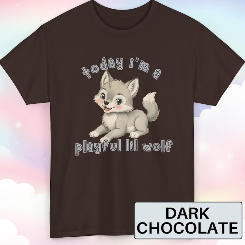 May include: Dark chocolate brown t-shirt featuring a cartoon wolf with the text "today i'm a playful lil wolf". The wolf is gray with blue eyes and pink cheeks. The shirt color is labeled "Dark Chocolate".
