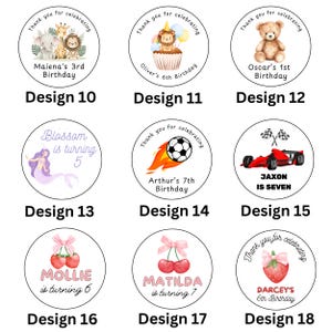May include: A collection of nine circular birthday-themed stickers. Designs include a safari scene, a lion on a cupcake, a teddy bear, a mermaid, a soccer ball, a race car, cherries, and a strawberry. Each design includes a name and age.