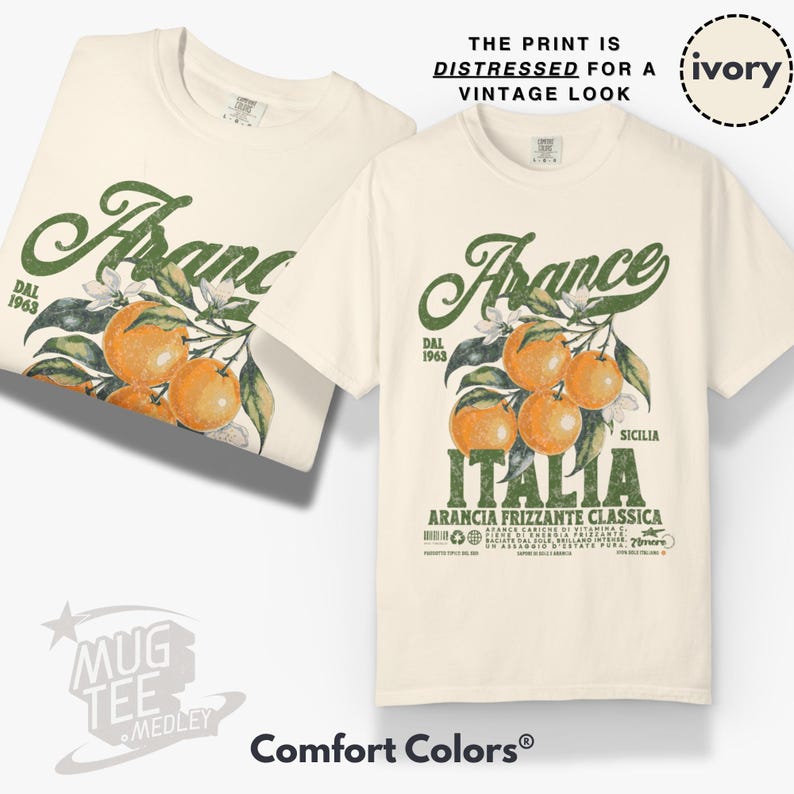 May include: Ivory-colored t-shirts with a distressed vintage print. The design features the word "Arance" above a branch of oranges, with the word "Italia" below. The text "The print is distressed for a vintage look" is also visible.