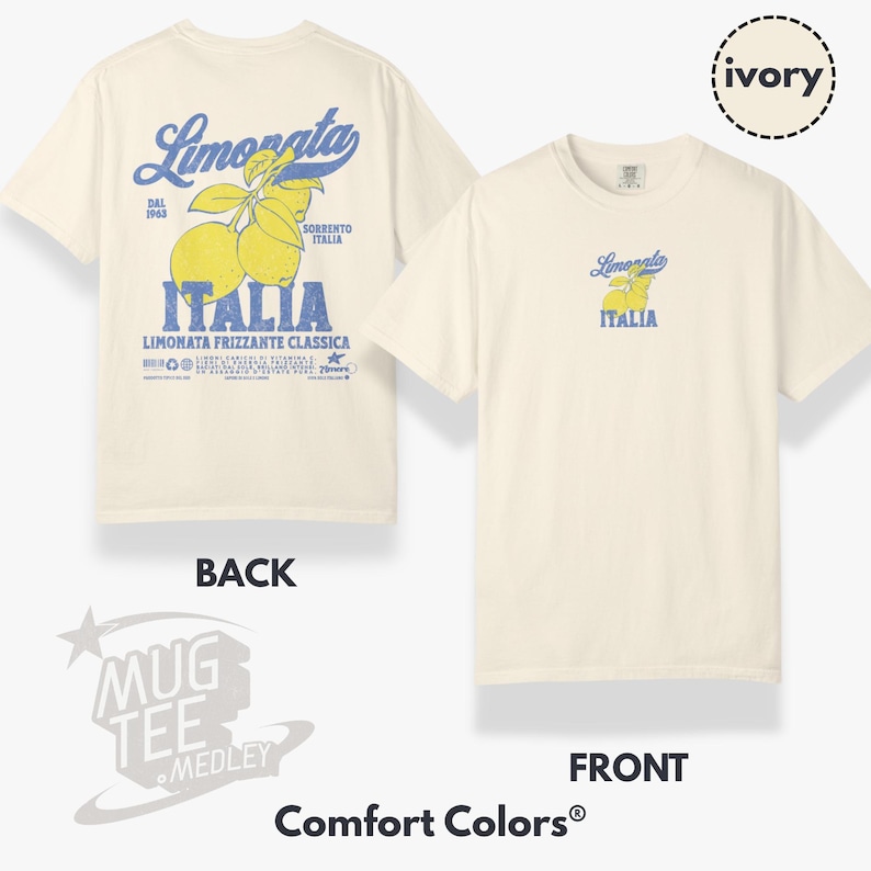 May include: Ivory-colored t-shirt featuring a front and back view. The back displays a large graphic with the word "Limonata" in blue, lemons, and the word "Italia." The front has a smaller version of the same design. The shirt is from Comfort Colors.