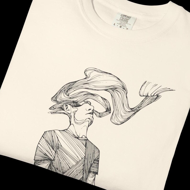 Comfort Colors® ivory unisex T-shirt featuring Prakash’s hand-drawn line art figure, black sketch printed on the front of a heavyweight cotton tee; relaxed fit graphic shirt shown flat on a dark background.