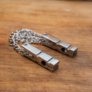 Morsetti per capezzoli a perno