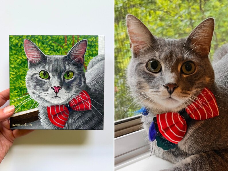May include: A painting and a photograph of a gray cat with green eyes and a red and white striped bow tie. The painting is on a small canvas with a green background. The cat in the photograph is looking at the camera.