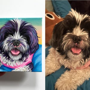 May include: A canvas painting of a Shih Tzu dog with black and white fur, a pink collar, and a pink tongue. The background transitions from yellow to blue. The dog's portrait is held by a person.