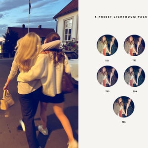 May include: Two people walking down a street at night. The person in the front is wearing a white sweater and black pants. The person in the back is wearing a black skirt and a white sweater. They are both smiling and holding hands.