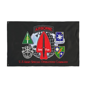 May include: Black flag featuring multiple military emblems, including a red arrowhead with the words "SINE PARI", a globe, and the word "AIRBORNE". The text "U.S ARMY SPECIAL OPERATIONS COMMAND" is at the bottom.