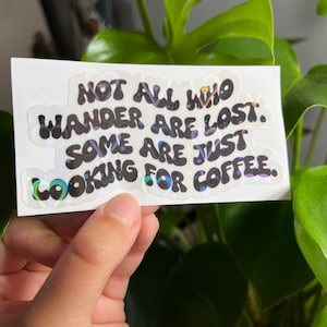 Not all who wander are lost. Some are just looking for coffee. Holographic water proof sticker, coffee lovers sticker, coffee pun sticker