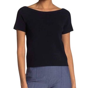 May include: A navy blue short-sleeved knit top with a boat neck.