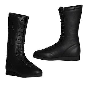May include: Two black leather boots with a lace-up design. One boot features star cutouts on the side. The boots have a flat sole and a tall shaft, suitable for various activities.