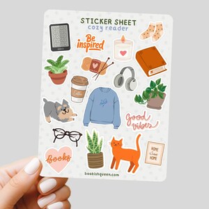 hand holding a sticker sheet for book lovers