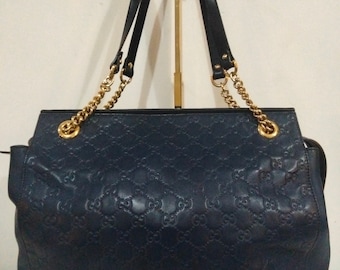 Gucci monogram handbag.