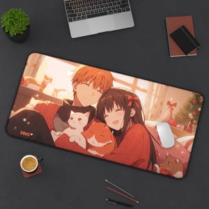 May include: A red and white anime-style mousepad featuring two characters, a man with orange hair and a woman with long black hair, holding a white and orange cat. The mousepad has the text "MMS" in the bottom left corner.