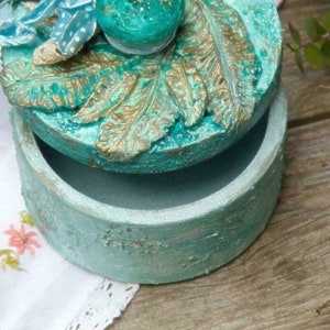 The box is turquoise small circle size concrete