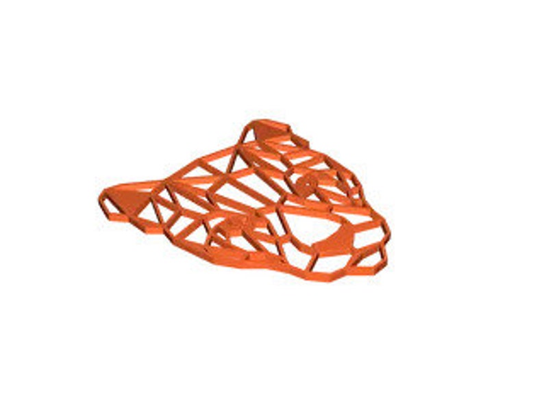 May include: Orange geometric wire sculpture of a stylized animal head, possibly a panther or a cat. The sculpture is made of thin wire and has a detailed design.
