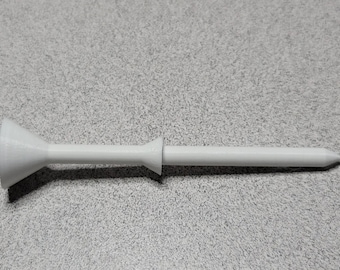 May include: A white plastic golf tee with a wide base and a pointed tip.