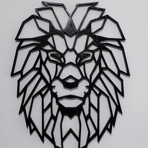 May include: Black geometric lion head wall decor. The lion's mane is made up of many triangles and lines.