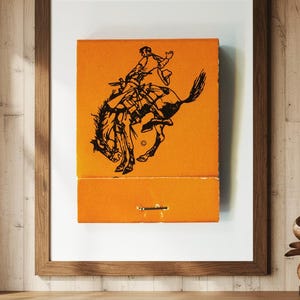 Vintage Matchbook Art of Pendleton Round Up Rodeo In Oregon | Orange Print of Western Themed Cowboy, Horses, and Native Culture
